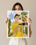 A 25 year old hispanic woman with brown hair with a blank frame in a studio