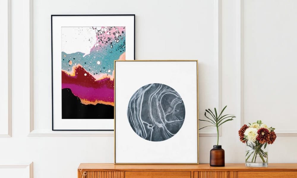 Elevate your space with this striking duo of abstract art prints designed to spark curiosity and conversation. This thoughtfully paired set combines two unique visual expressions: one print features a dynamic fusion of cosmic colors and fluid textures, while the other offers a meditative contrast with a monochrome circular motif that evokes the natural flow of marble or planetary terrain.