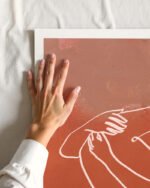 Abstract figurative terracotta line art fine art print titled “The Embrace” by Uma Gokhale for contemporary interiors
