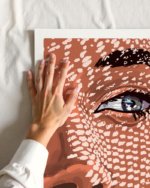 figurative facial woman fashion tropical beachy painterly fine art print titled “Under the jute hat” by Uma Gokhale for contemporary interiors